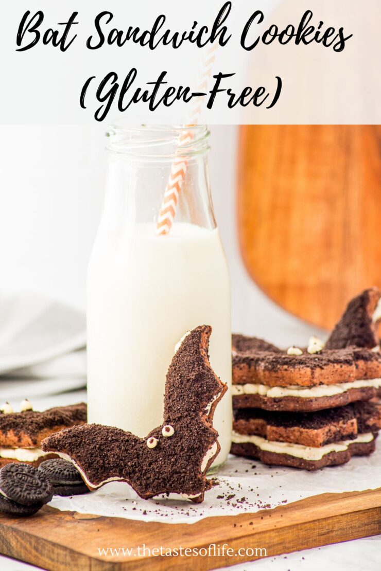 A bottle of milk with a striped straw sits next to a stack of bat-shaped chocolate sandwich cookies filled with cream, one cookie standing upright. The text Bat Sandwich Cookies (Gluten-Free) is at the top.
