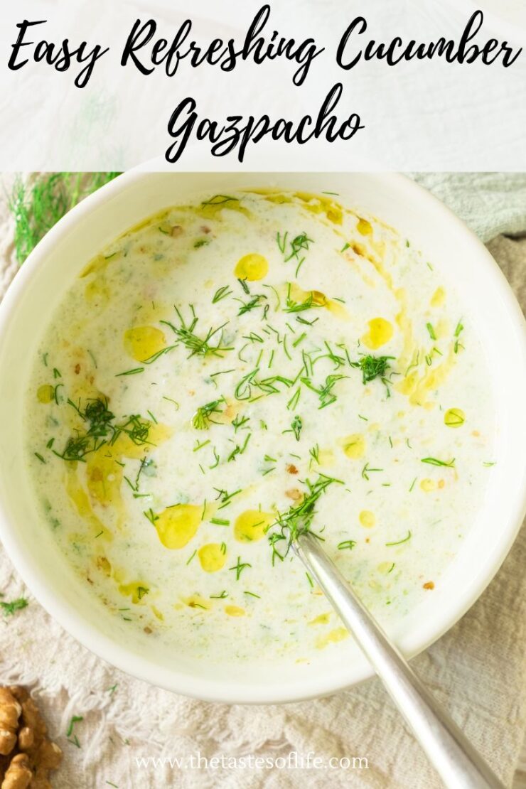A bowl of creamy cucumber gazpacho garnished with fresh dill and drizzled with olive oil, with a spoon inside. The text at the top reads Easy Refreshing Cucumber Gazpacho.