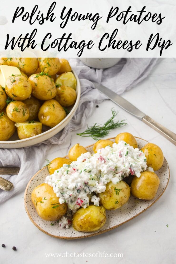 A plate of Polish young potatoes topped with cottage cheese dip, garnished with fresh dill. A bowl of plain boiled potatoes with dill is in the background, along with a knife, napkin, and herbs on a marble surface.