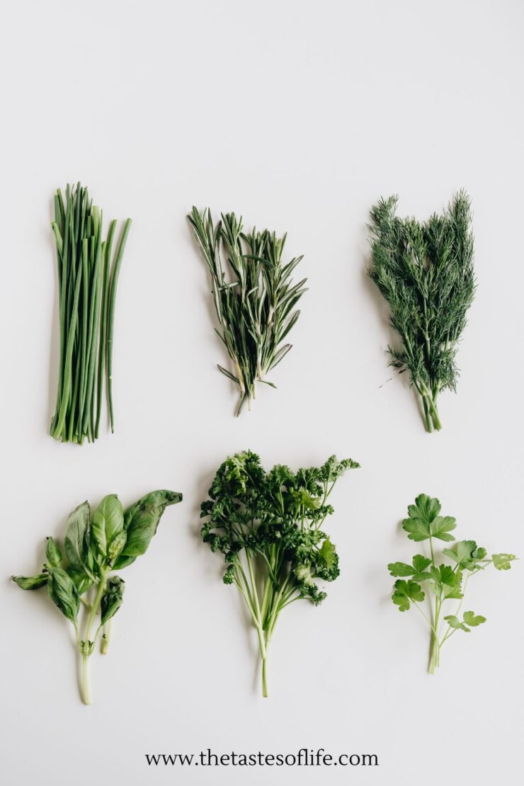 Six types of fresh green herbs&mdash;chives, rosemary, dill, basil, parsley, and cilantro&mdash;are arranged neatly on a white background. The website www.thetastesoflife.com is at the bottom.