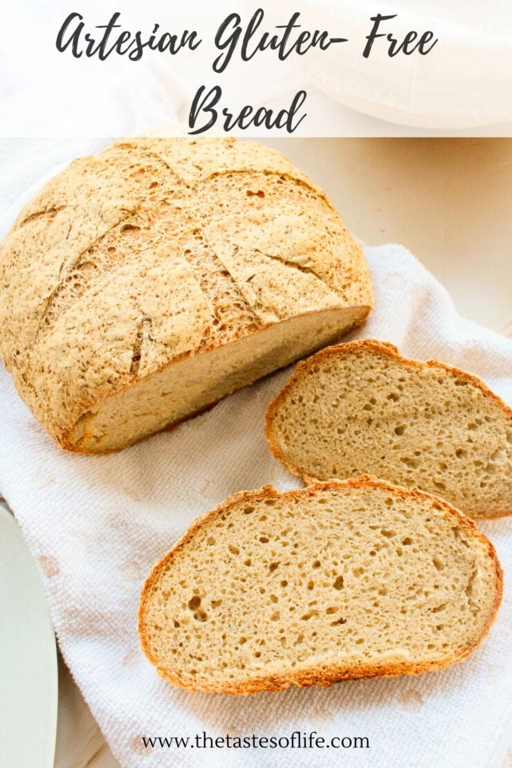 A round loaf of artisan gluten-free bread with a crisp crust, partially sliced to reveal a soft, airy interior, displayed on a white cloth. The text reads Artisan Gluten-Free Bread and thetasteoflife.com at the bottom.