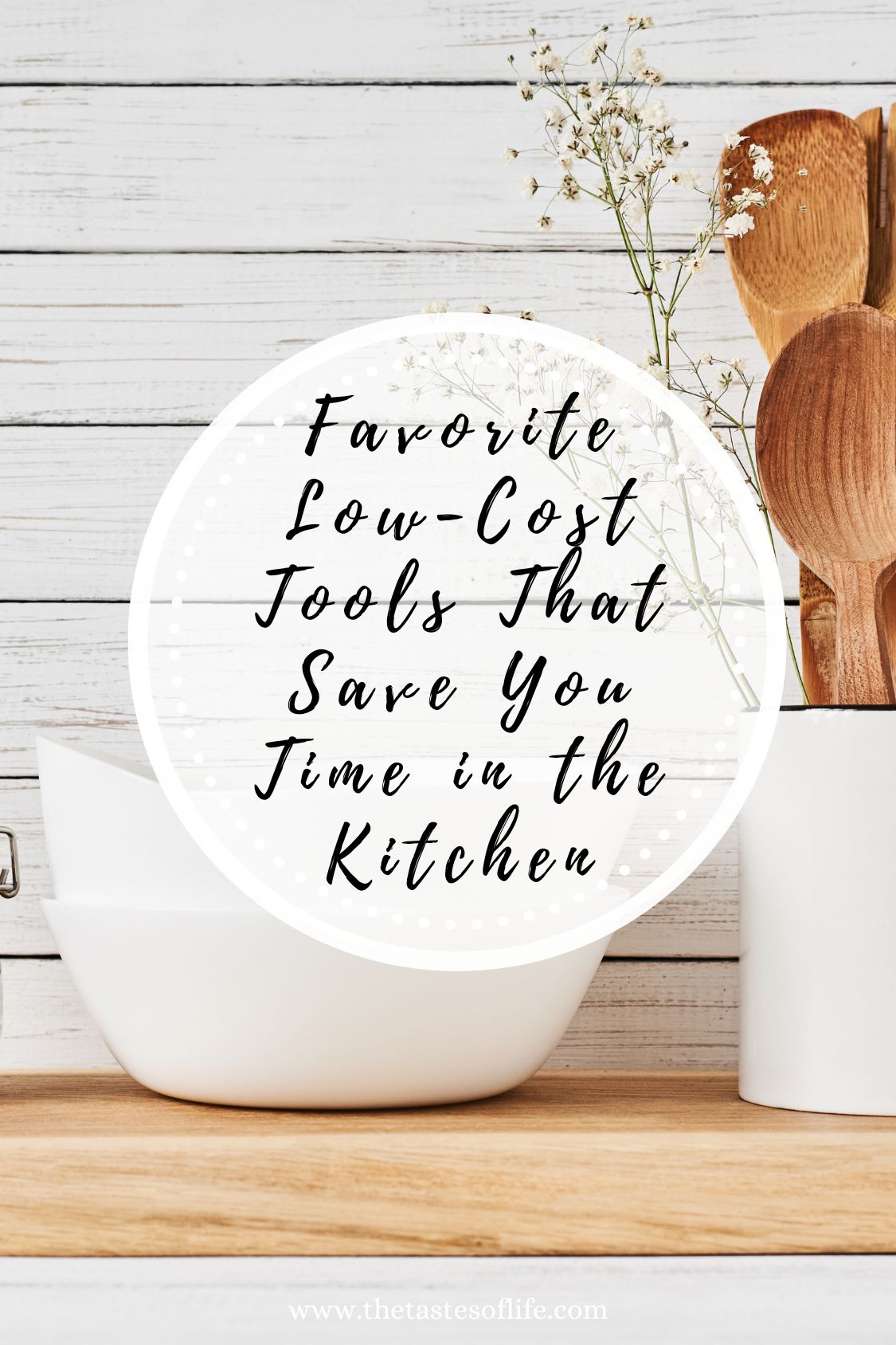 White bowls stacked next to a container holding wooden utensils and small white flowers on a wooden surface. Text over the image reads: Favorite Low-Cost Tools That Save You Time in the Kitchen.