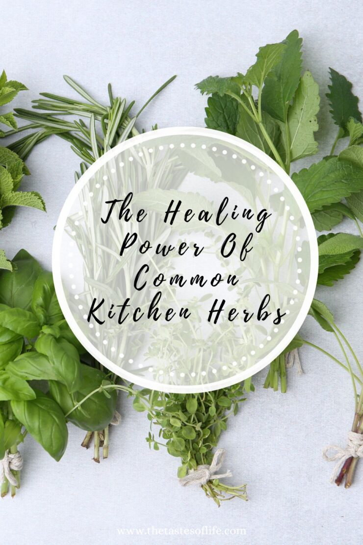 A flat lay of fresh kitchen herbs, including basil, parsley, mint, and rosemary, with the text &ldquo;The Healing Power Of Common Kitchen Herbs&rdquo; written in a white circle overlay in the center.