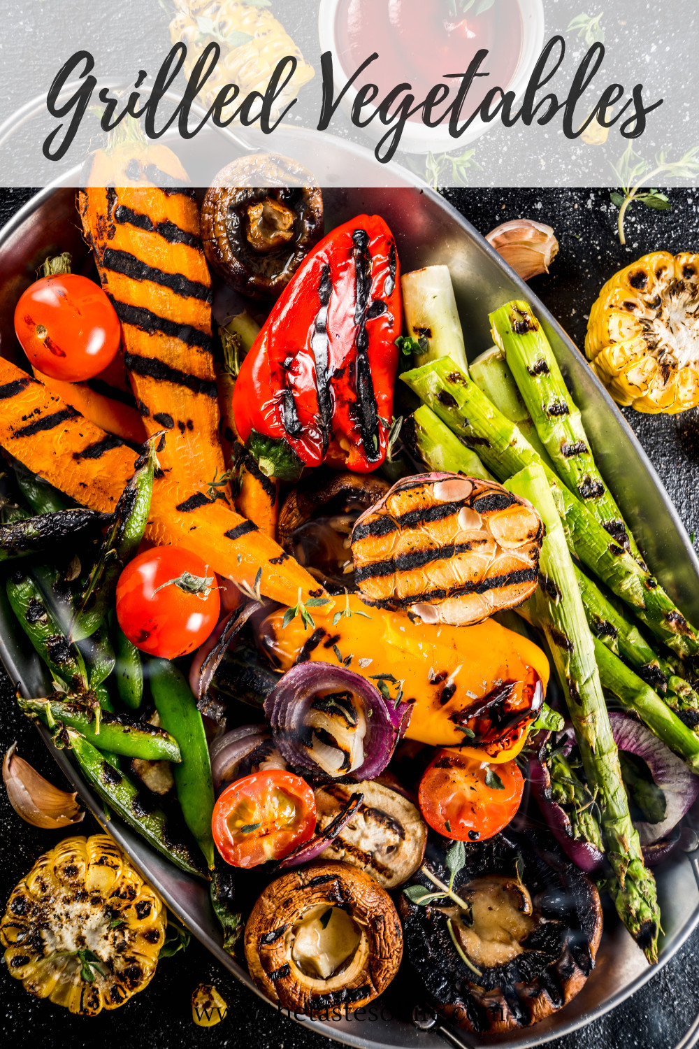 A platter of assorted grilled vegetables including bell peppers, asparagus, mushrooms, onions, cherry tomatoes, corn, and green beans with Grilled Vegetables written at the top.