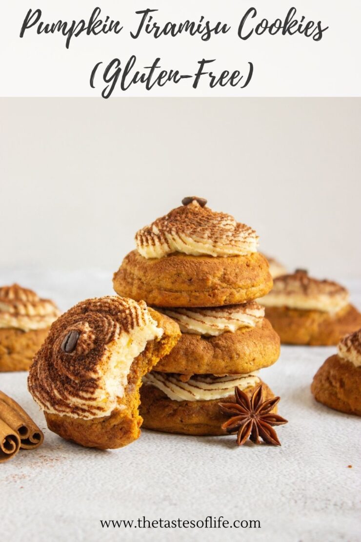 A stack of gluten-free pumpkin tiramisu cookies topped with frosting and coffee beans, with one bitten cookie in the foreground and cinnamon sticks and star anise nearby.