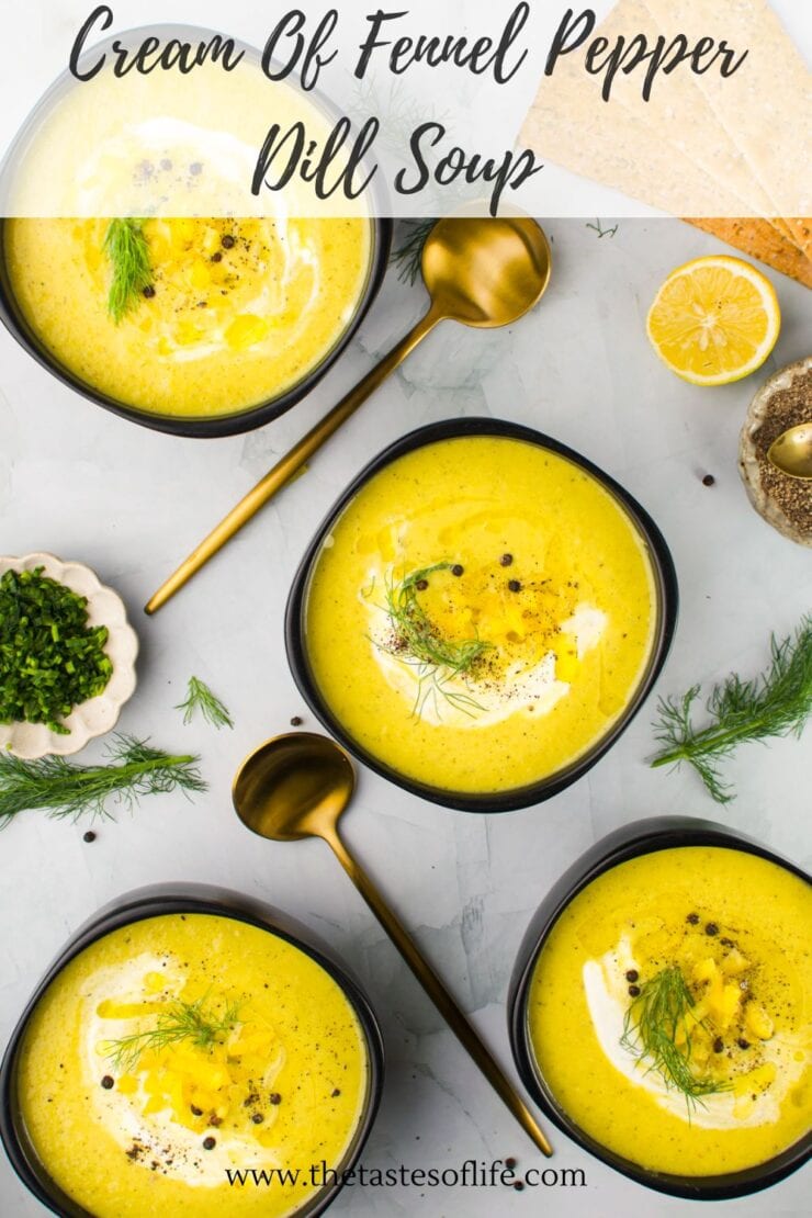 Four bowls of creamy yellow fennel pepper dill soup, each garnished with dill and black pepper. Gold spoons, lemon, flatbread, fresh herbs, and soup toppings are arranged artistically around the bowls.
