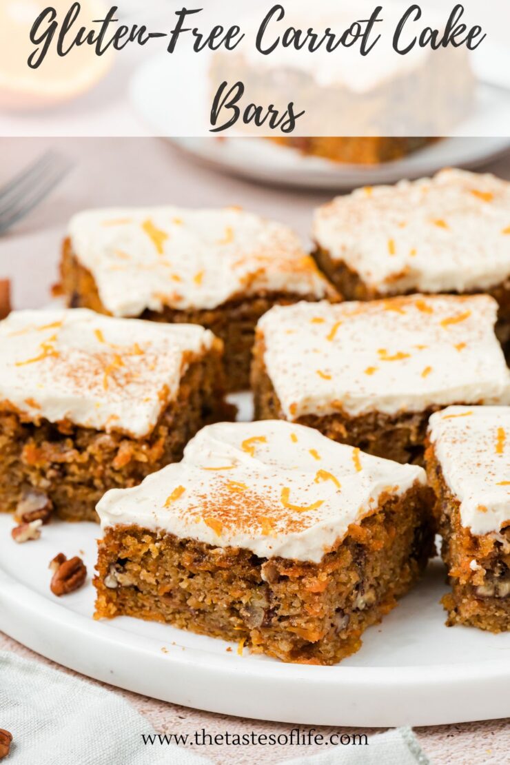Six frosted carrot cake bars with grated carrot garnish are arranged on a white platter. The bars are moist, topped with creamy frosting, and sprinkled with orange zest. Text above reads: Gluten-Free Carrot Cake Bars..