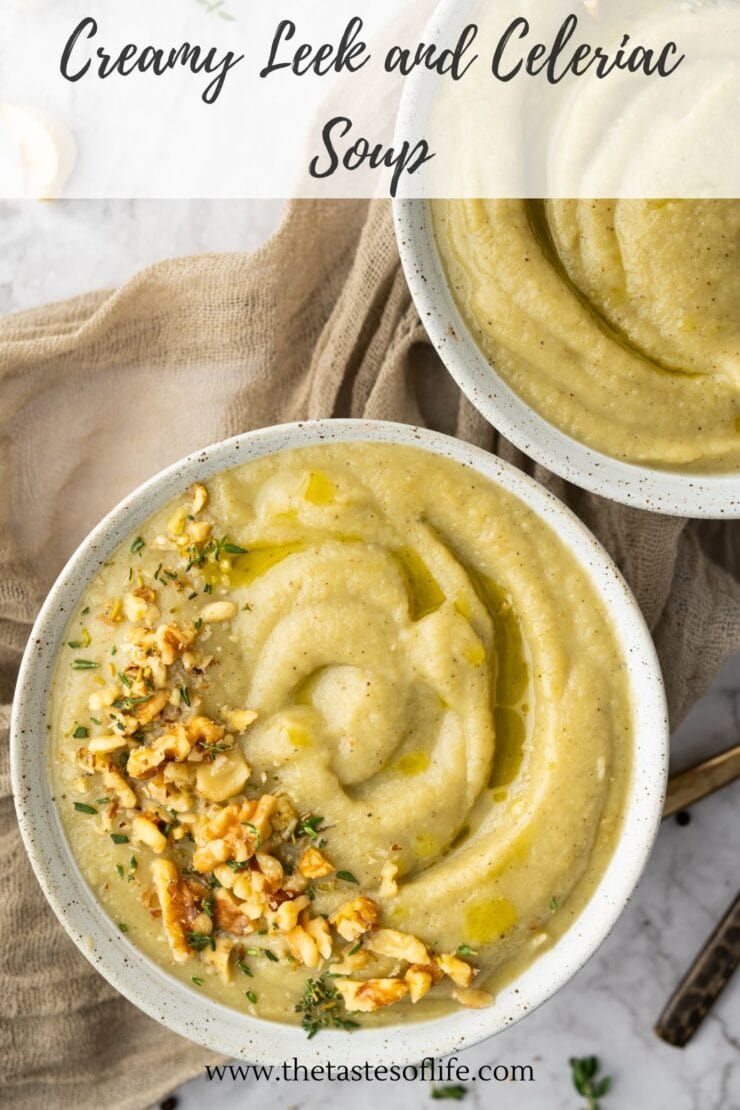 Two bowls of creamy leek and celeriac soup , topped with chopped nuts and herbs.