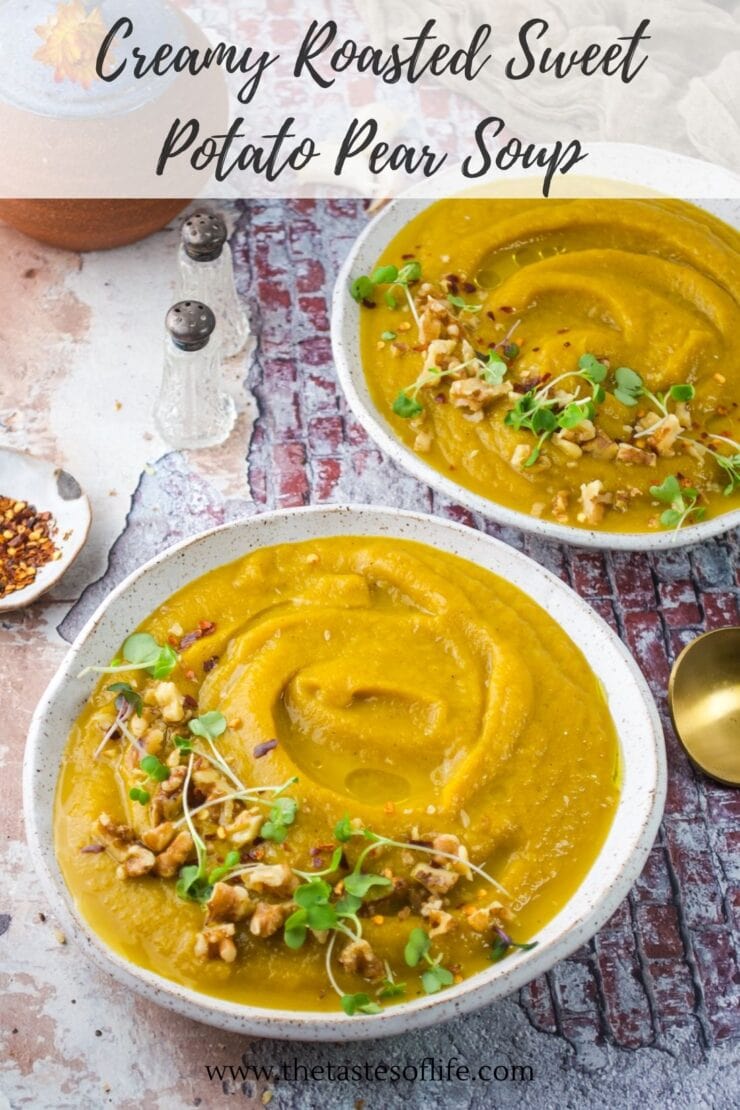Two bowls of creamy roasted sweet potato pear soup topped with microgreens, walnuts, and red pepper flakes, next to a gold spoon and salt and pepper shakers. Recipe title is written at the top.