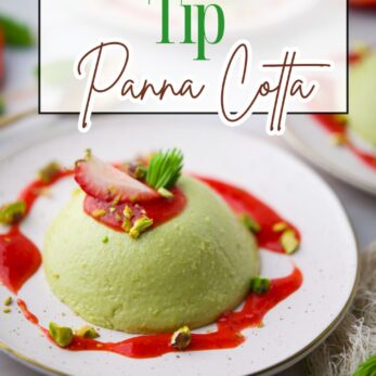 A plate with green coconut spruce tip panna cotta topped with strawberry, spruce tip, and pistachios, drizzled with red sauce. Text overlay reads: Coconut Spruce Tip Panna Cotta.