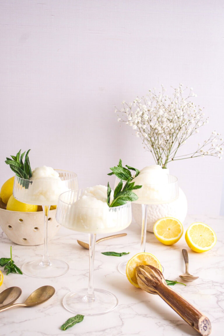 Lemon Sorbet in 3 glasses on the table with basil