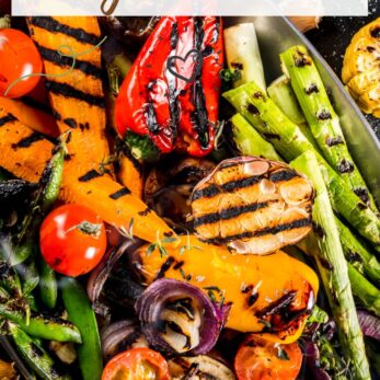 A colorful platter of grilled vegetables including peppers, tomatoes, asparagus, corn, onions, and mushrooms with grill marks, garnished with herbs. Text reads “Grilled Vegetables” and “thetastesoflife.com”.