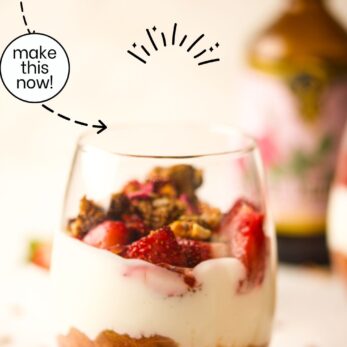 A glass filled with Rhubarb Strawberry Parfait slices sits on a light surface. The text reads Rhubarb Strawberry Parfait and easy to make, incredible taste. A strawberry and granola are nearby.