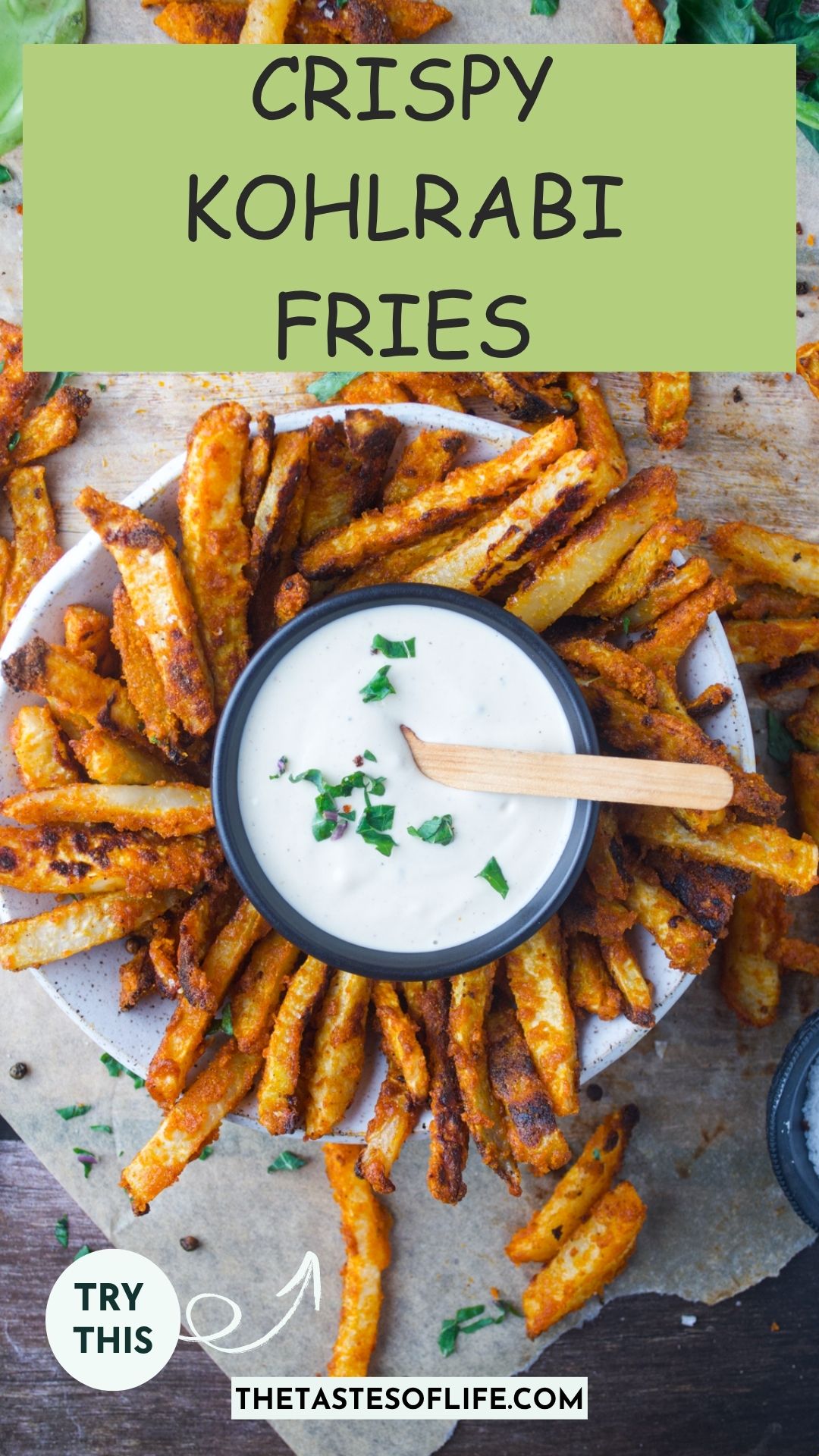 A bowl of crispy kohlrabi fries surrounds a small bowl of creamy dipping sauce with a wooden spoon. Text reads, Crispy Kohlrabi Fries and Try This.